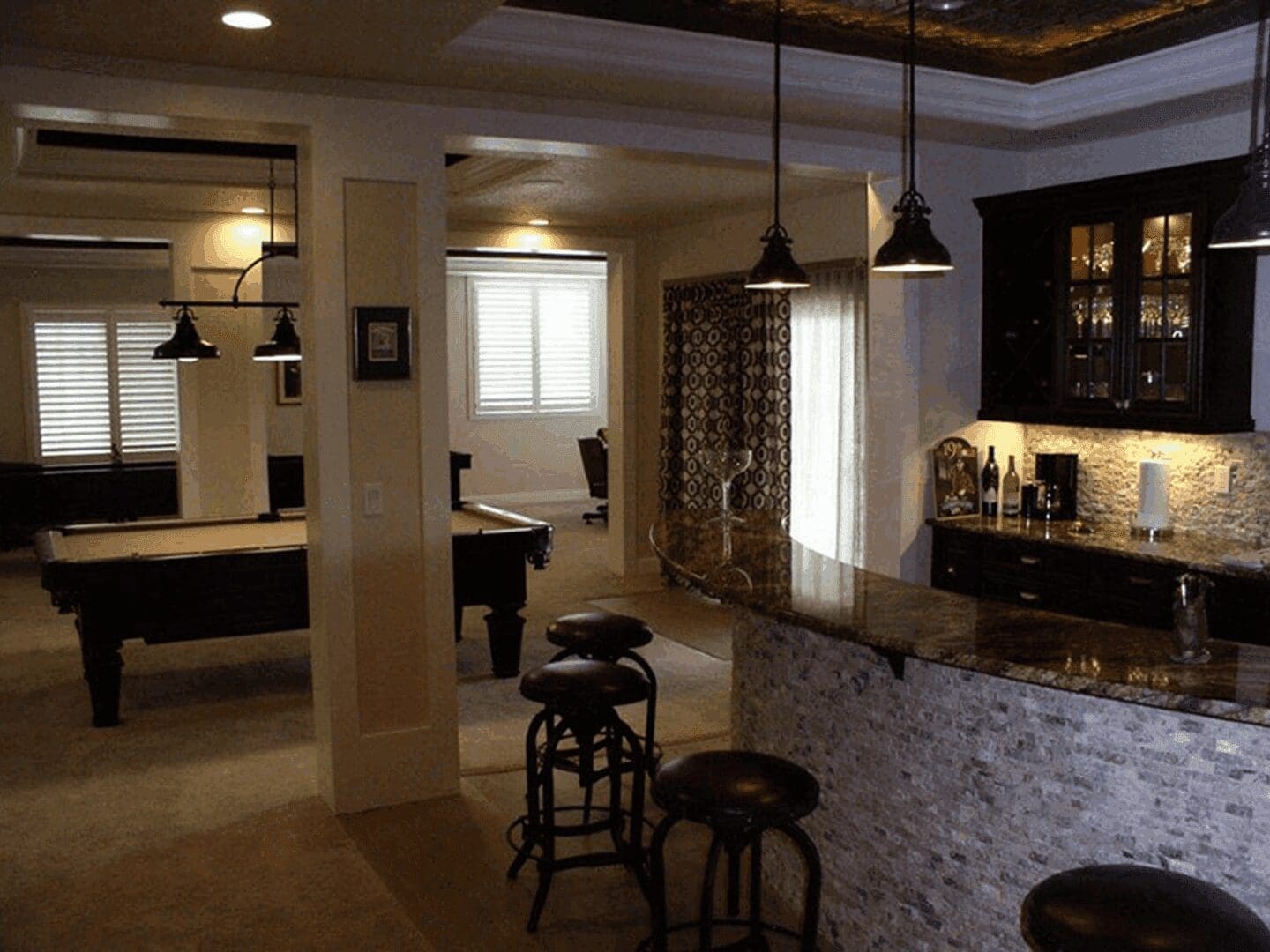 Cozy basement with pool table and bar