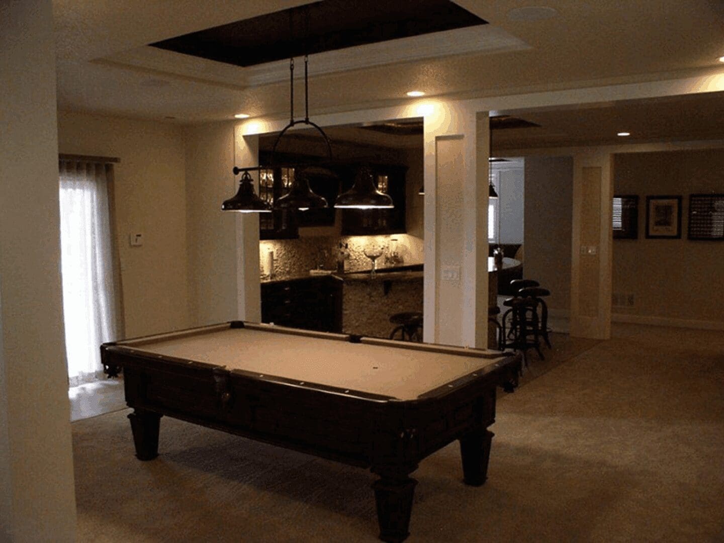 Cozy home bar area with stools