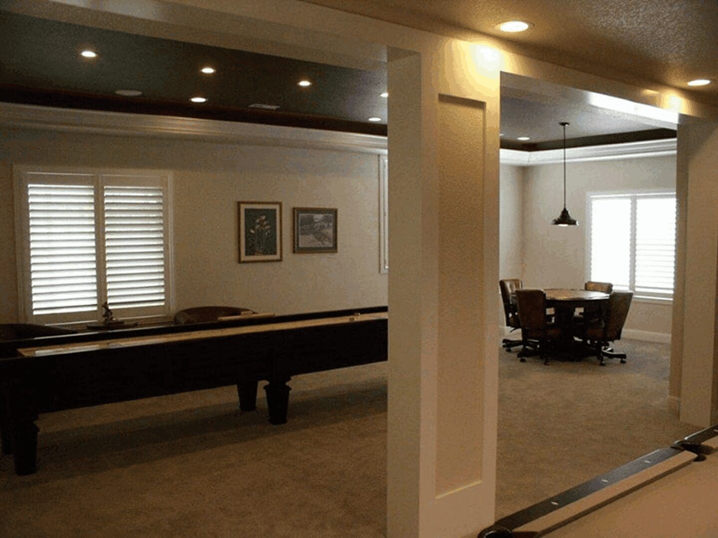 Game room with shuffleboard table